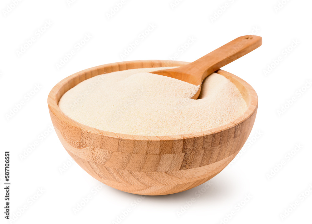 Bowl of raw semolina on white background