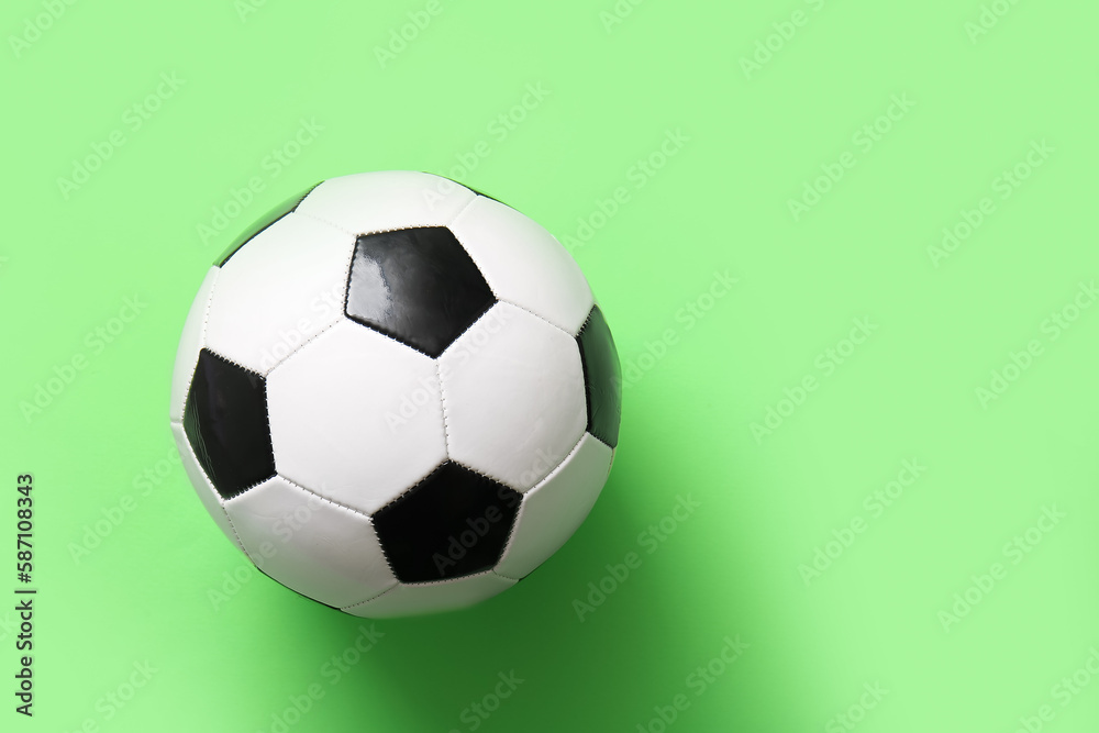 Soccer ball on green background