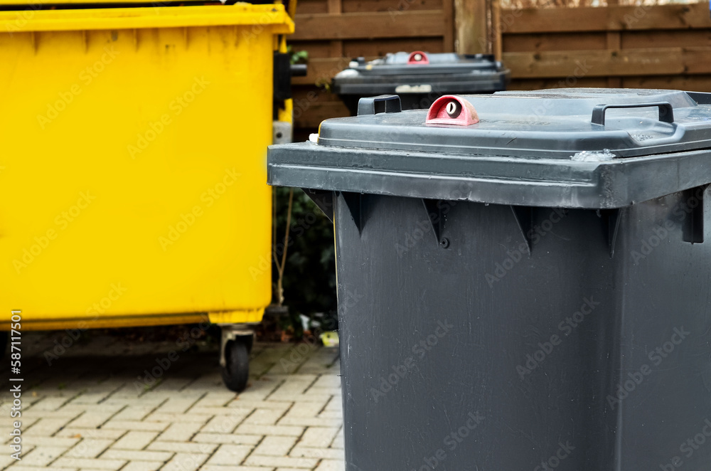 View of garbage container in city on winter day, closeup