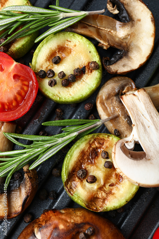 Tasty vegetables on modern electric grill, closeup