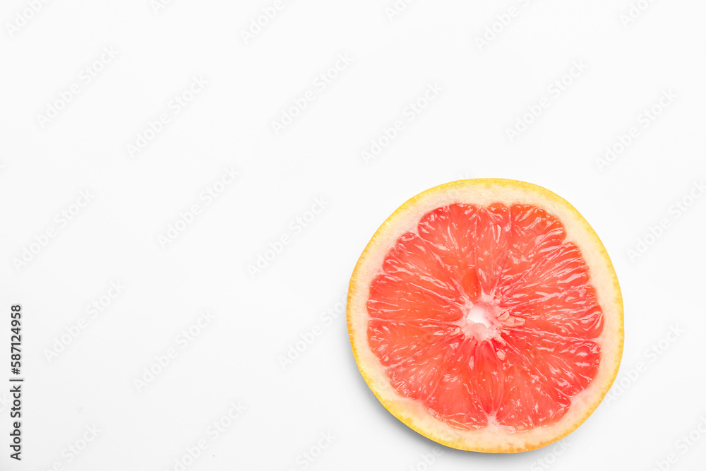 Slice of juicy grapefruit isolated on white background