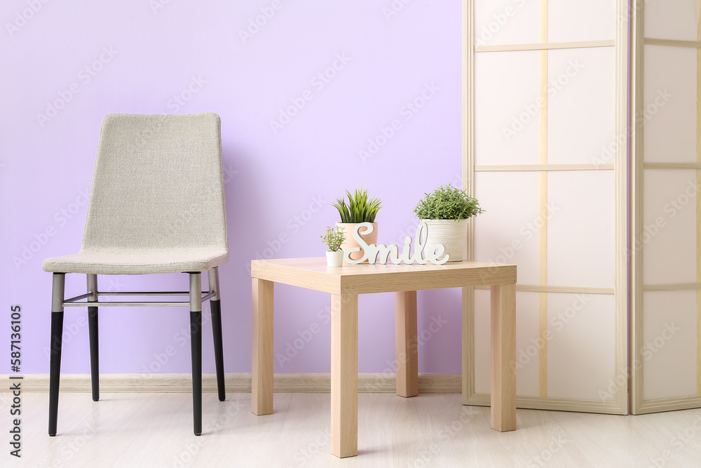 Artificial houseplants on table in living room