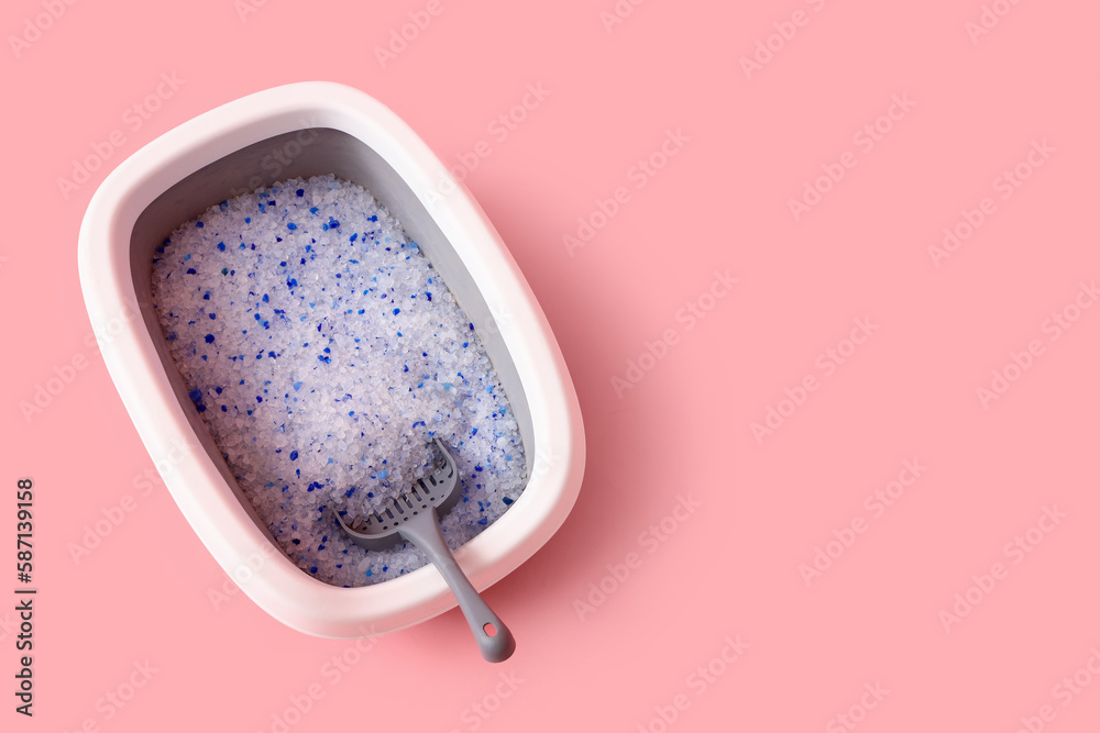 Litter box for cat on pink background, top view