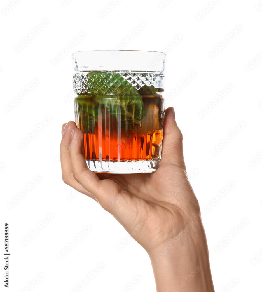 Woman holding glass of cold rum on white background