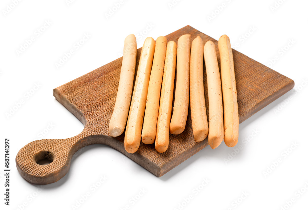 Wooden board with tasty Italian Grissini on white background