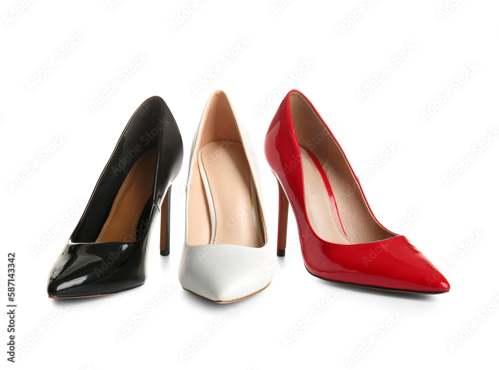 Stylish high heeled shoes on white background