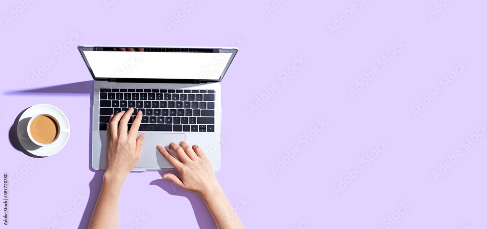 Person using a laptop computer from above