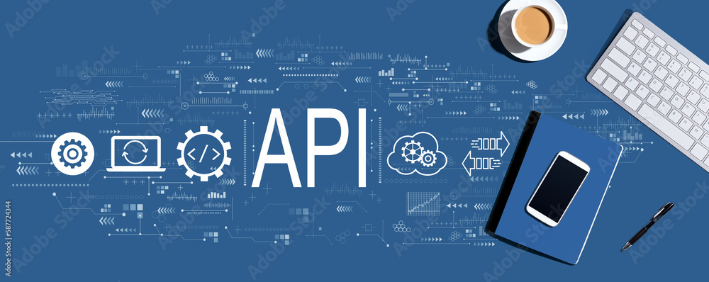 API - application programming interface concept with a computer keyboard and office items