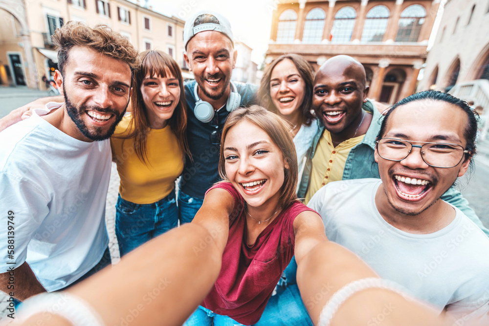 Multicultural friends taking selfie picture with smart mobile phone outdoors - Happy young people ha