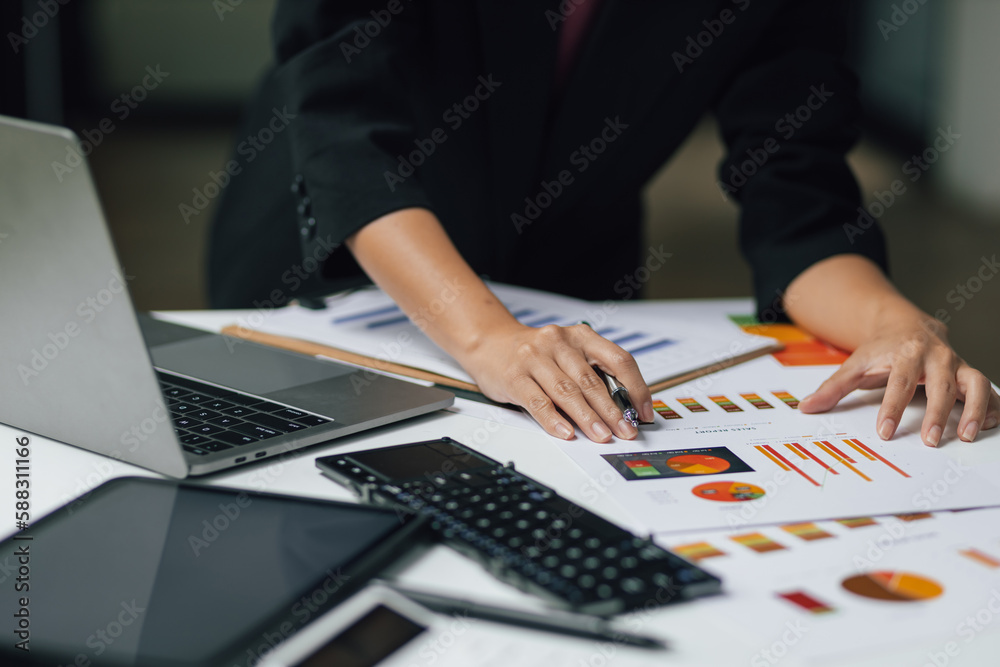 Financial consultant businesswoman analyzing charts in company financial report, Analyze investment 