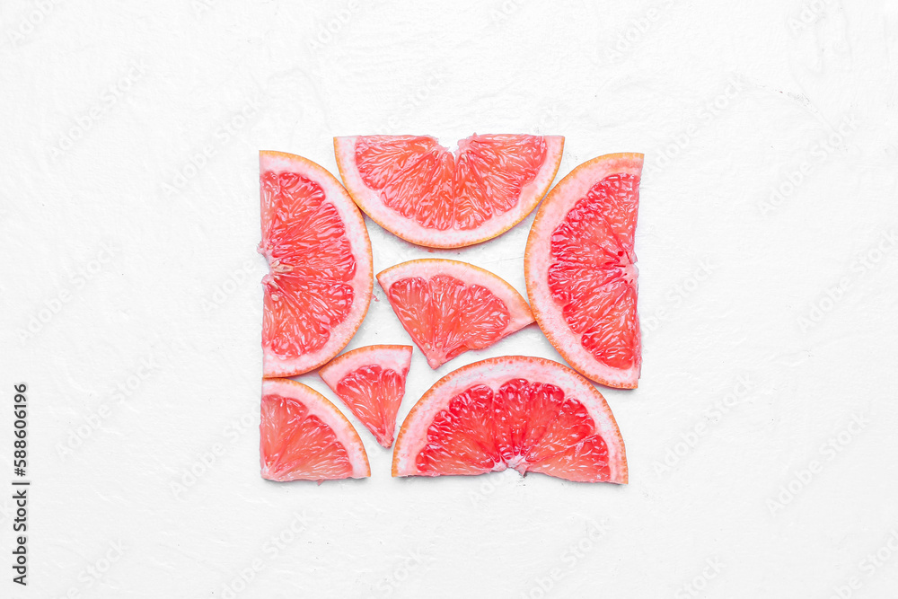 Square made of grapefruit slices on light background