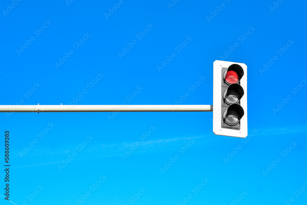 View of traffic lights against blue sky