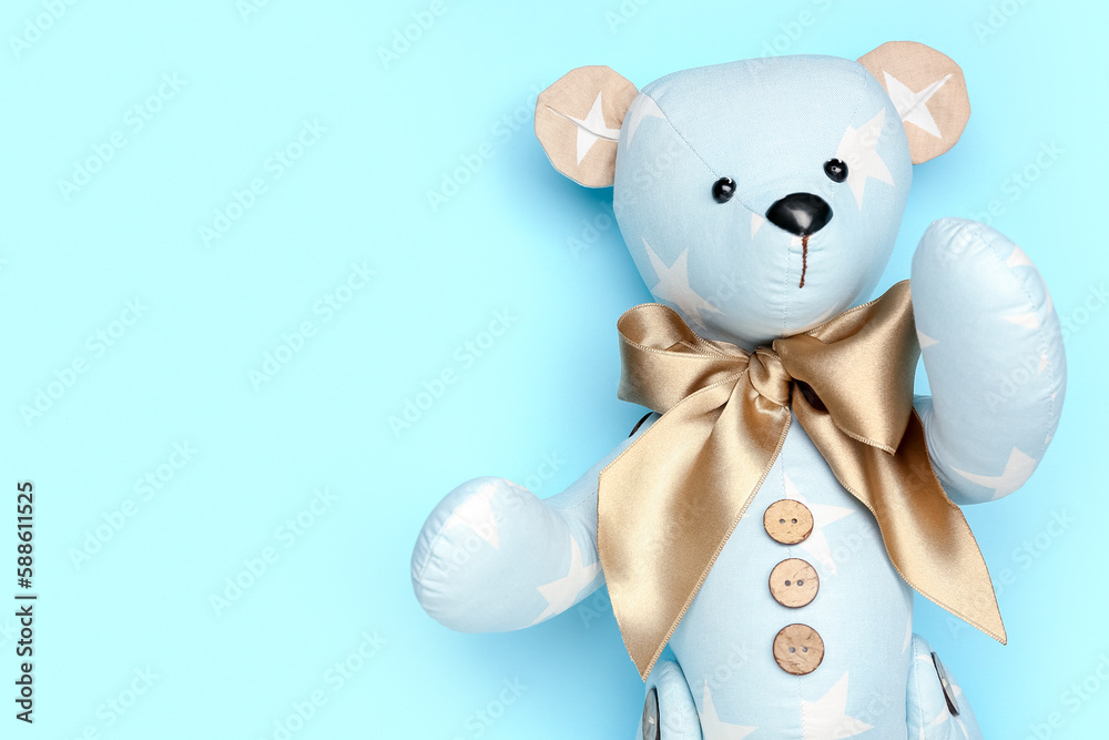 Toy bear on blue background