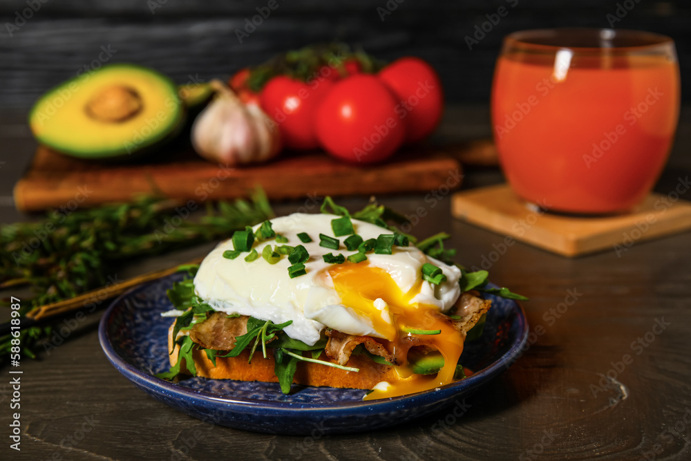 Plate with tasty egg Benedict on table