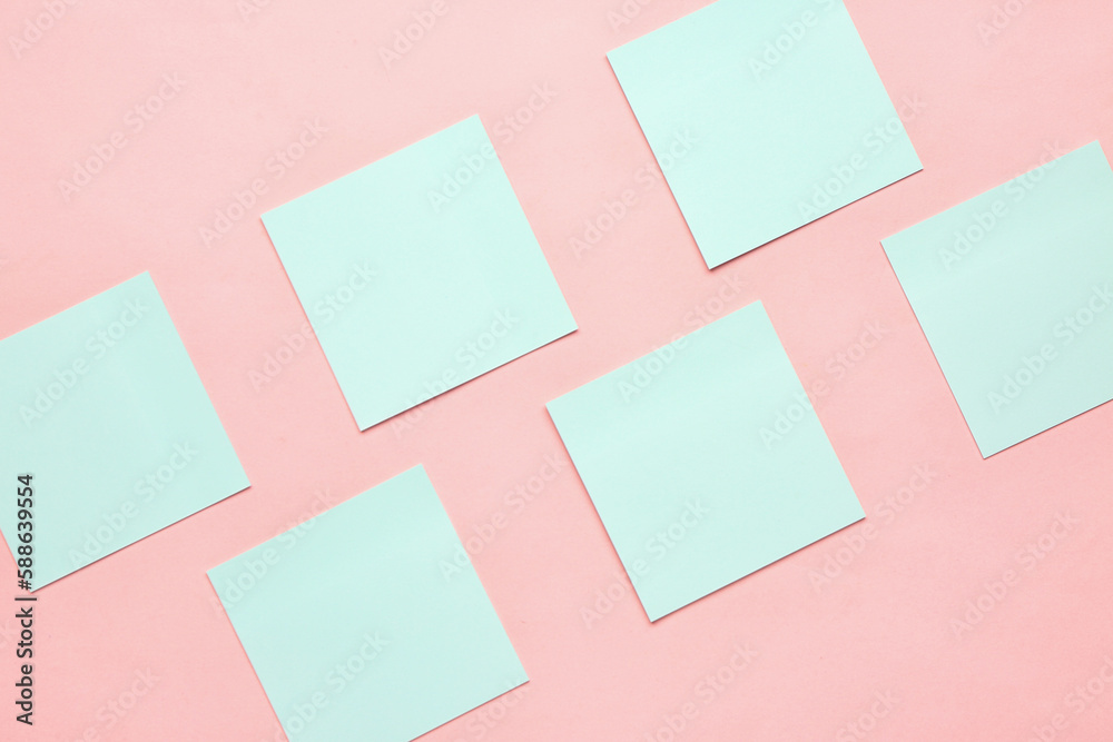 Blue sticky notes on pink background