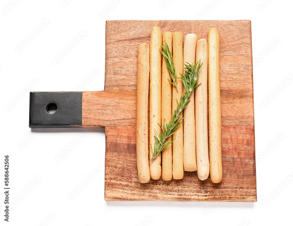 Wooden board with tasty Italian Grissini on white background