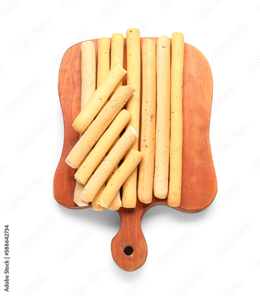 Wooden board with tasty Italian Grissini on white background