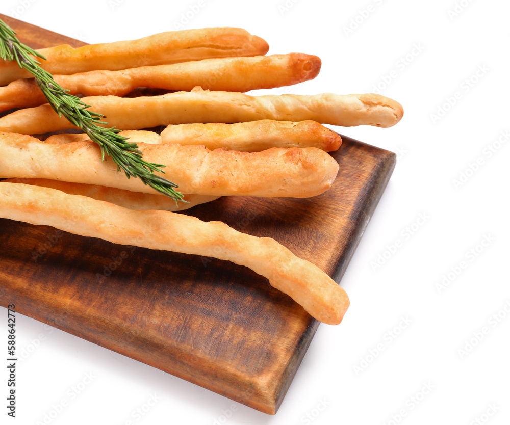 Wooden board with tasty Italian Grissini on white background, closeup