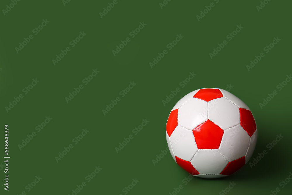 Soccer ball on green background