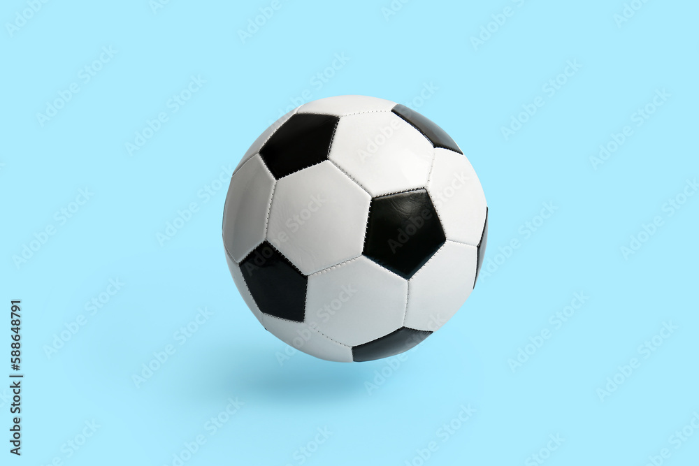 Soccer ball on light blue background