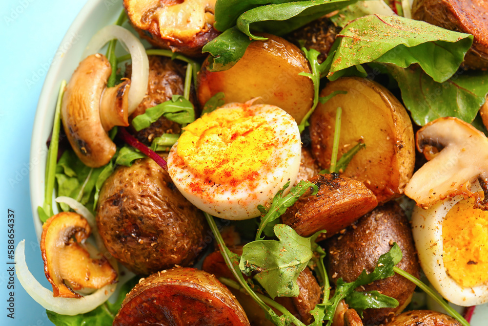 Plate of tasty potato salad with eggs and mushrooms, closeup