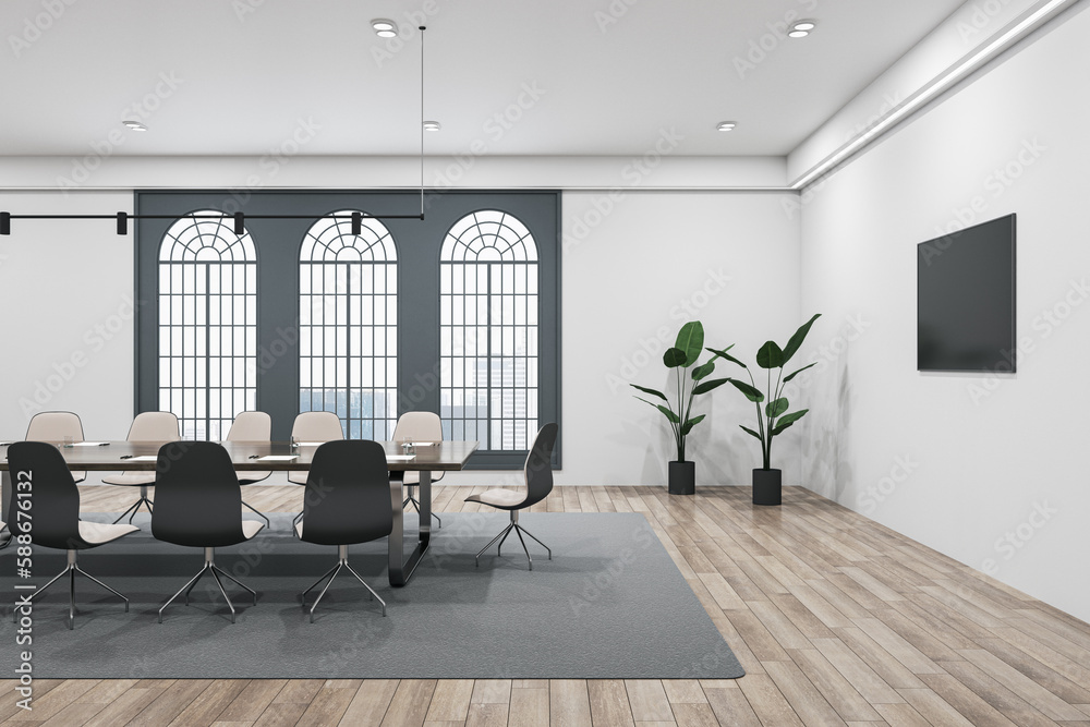 Bright conference room interior with wooden flooring, carpet, furniture, equipment and tall windows 