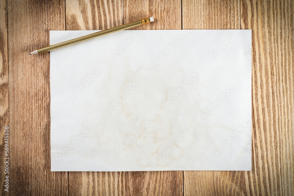 Sheet of paper lying on wooden table