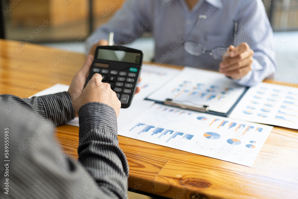 Financial advisor meeting discusses chart analysis in business growth reports and plans investments.