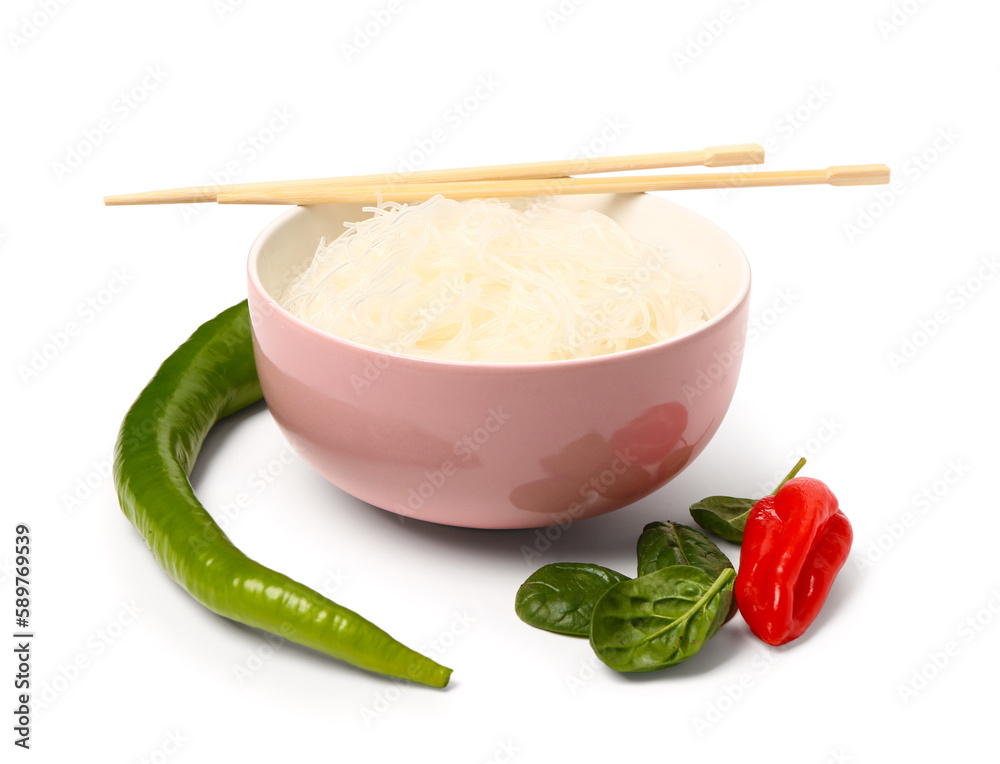 Bowl with tasty rice noodles, chopsticks and vegetables isolated on white background