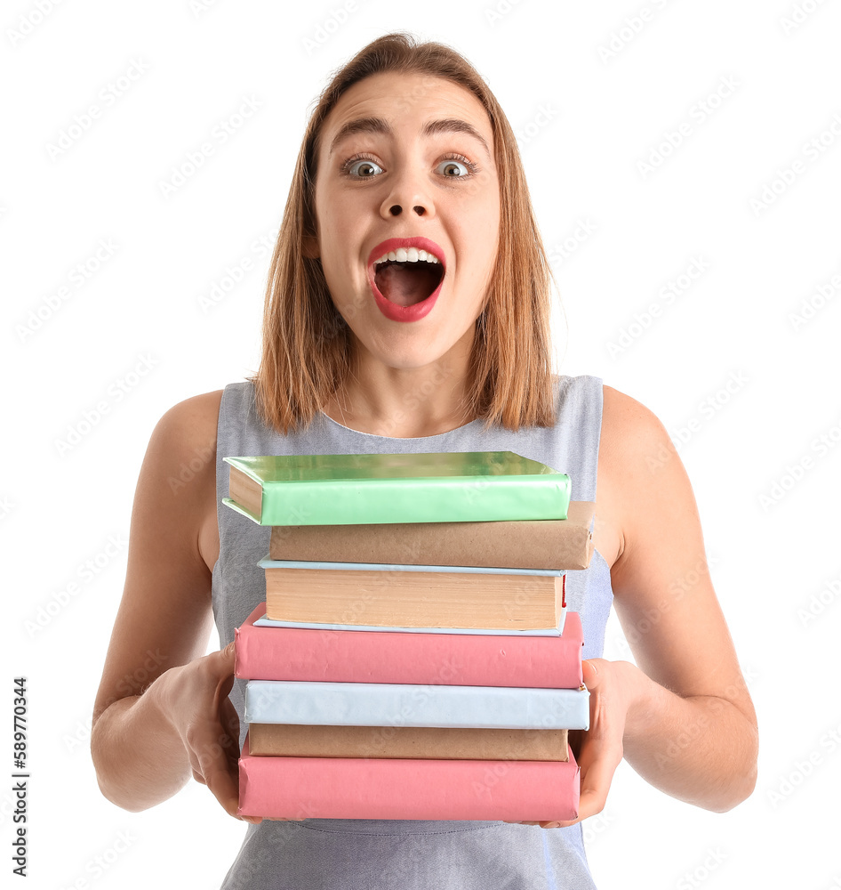 Surprised young woman with books on white background