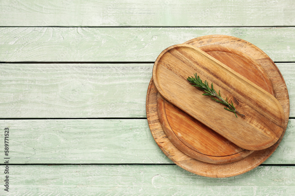 Set of kitchen boards on color wooden background