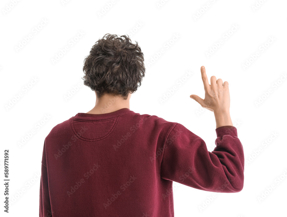 Young man showing loser gesture on white background, back view