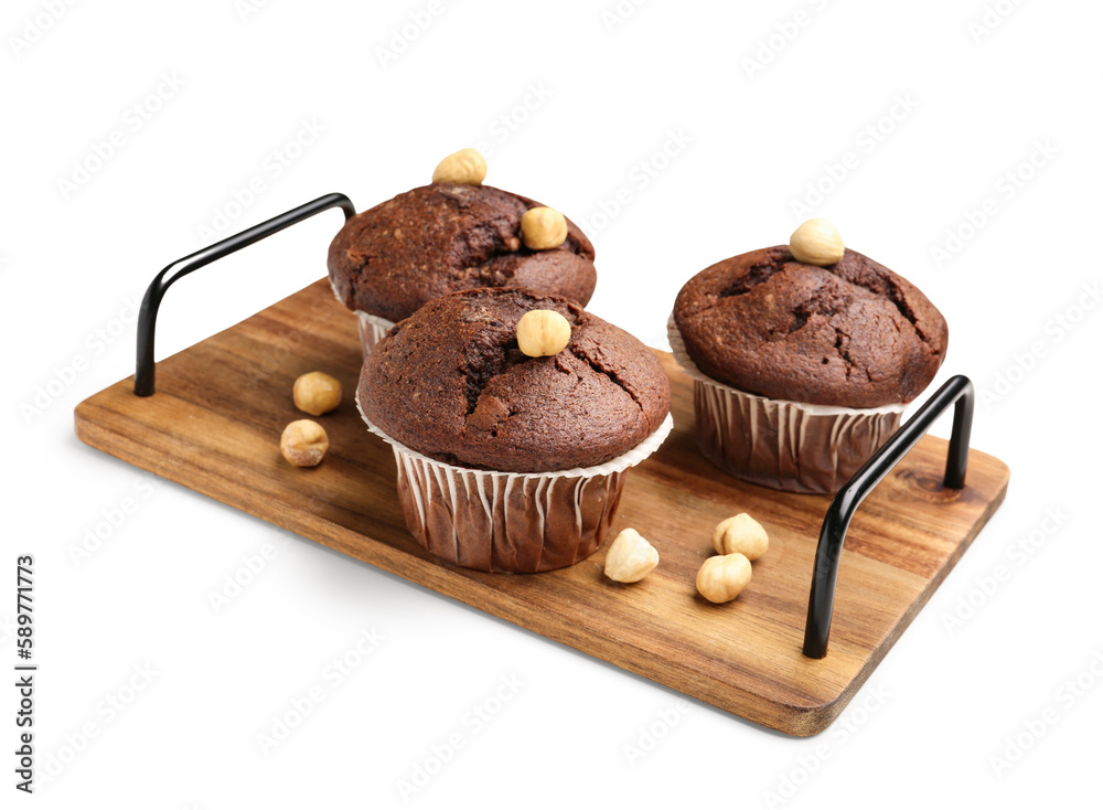 Wooden board with tasty chocolate cupcakes isolated on white background