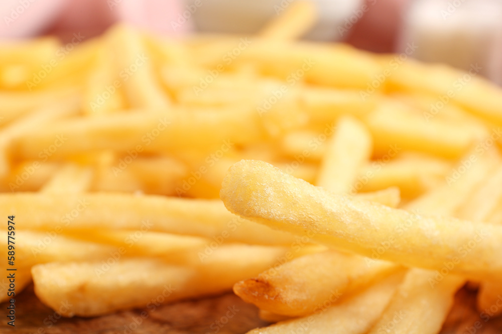 Tray with tasty french fries, closeup