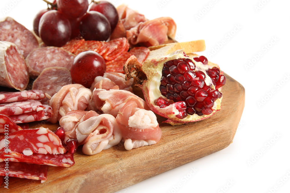 Wooden board with assortment of tasty deli meats isolated on white background, closeup