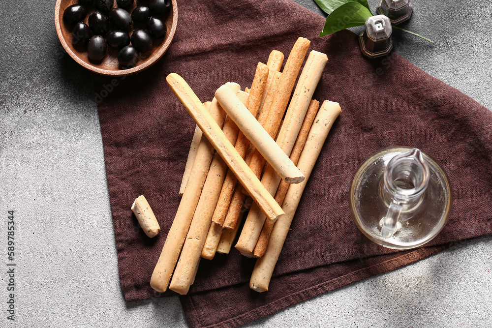 Tasty Italian Grissini on light background