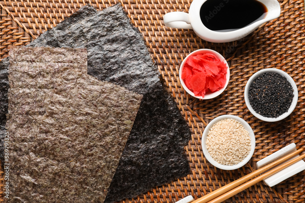 Nori sheets with sesame seeds and ginger on table