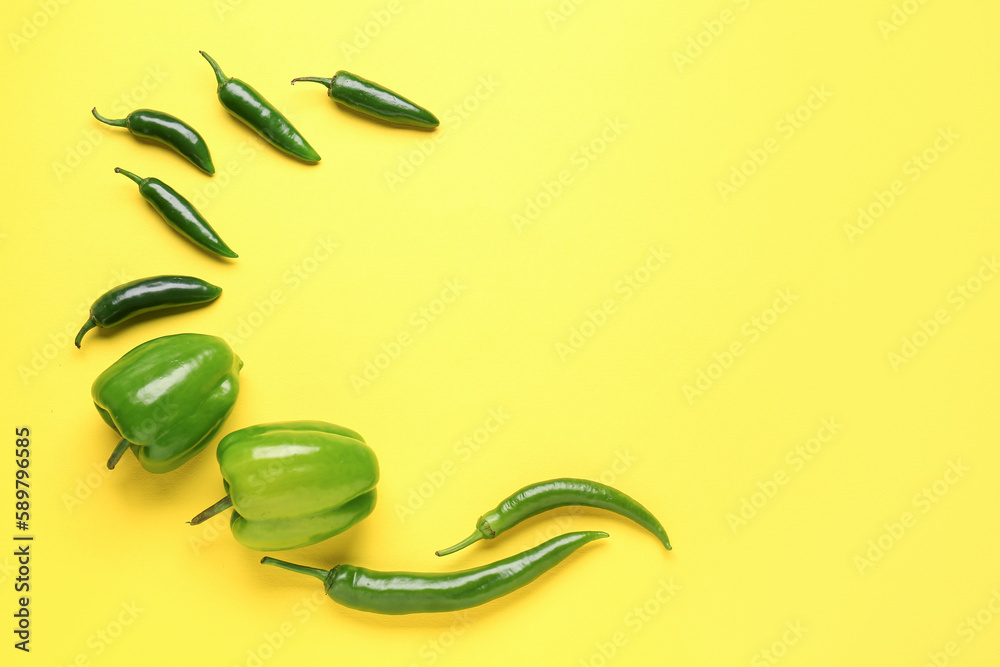 Composition with peppers on yellow background