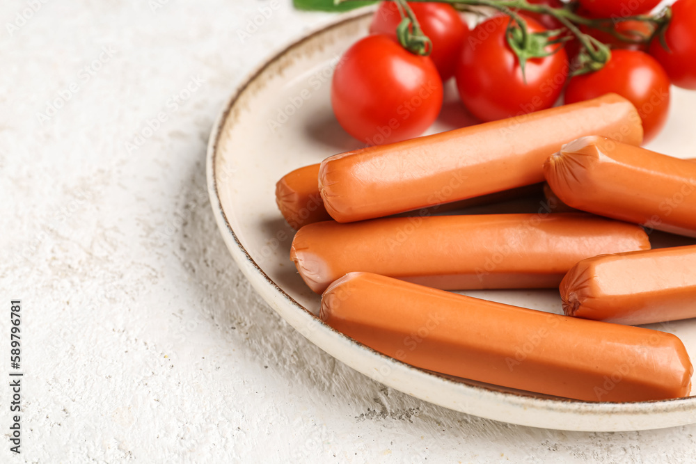 Plate with tasty sausages on light background, closeup