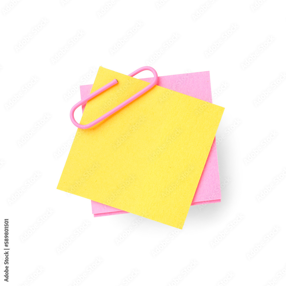 Pink and yellow sticky notes with paper clip on white background