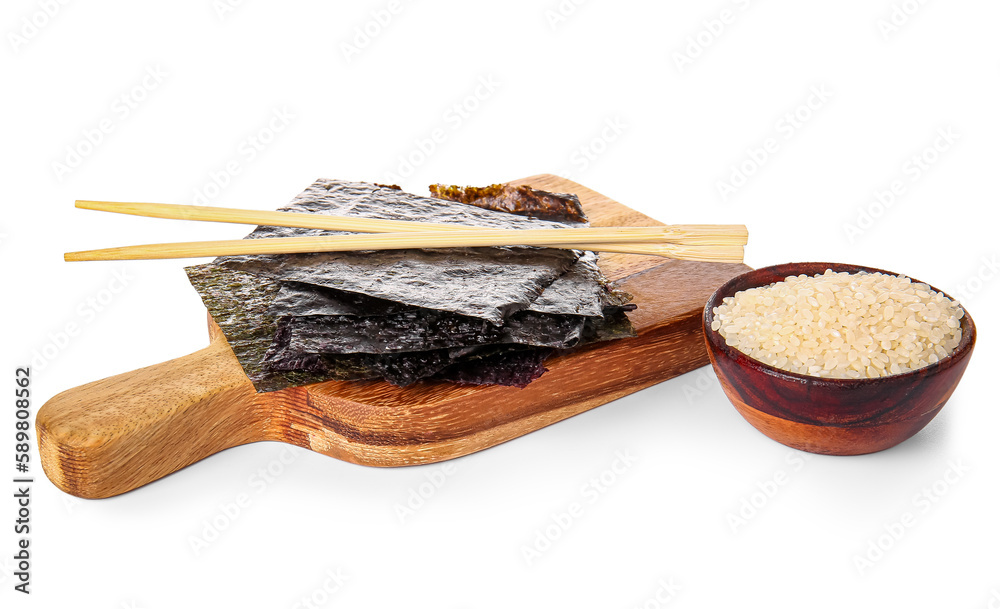 Wooden board with natural nori sheets, chopsticks and bowl of rice isolated on white background