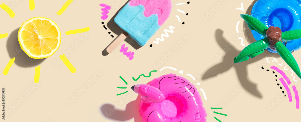 Summer concept with a flamingo float, lemon sunlight and a popsicle - flat lay