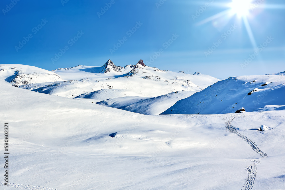 East Greenland landscape with mountains and sun