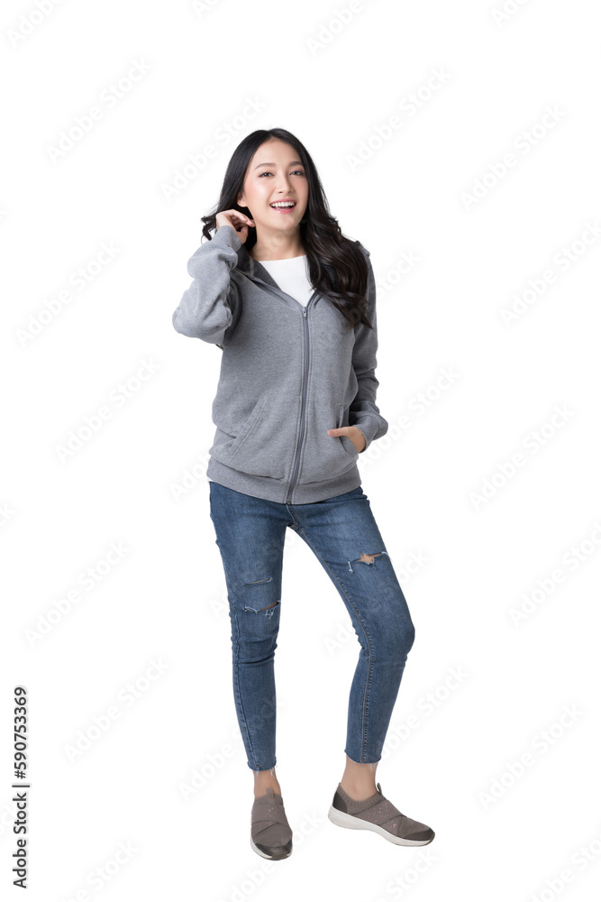 Full length portrait of young beautiful Asian woman in hoodie sweatshirt and blue jeans isolated ove