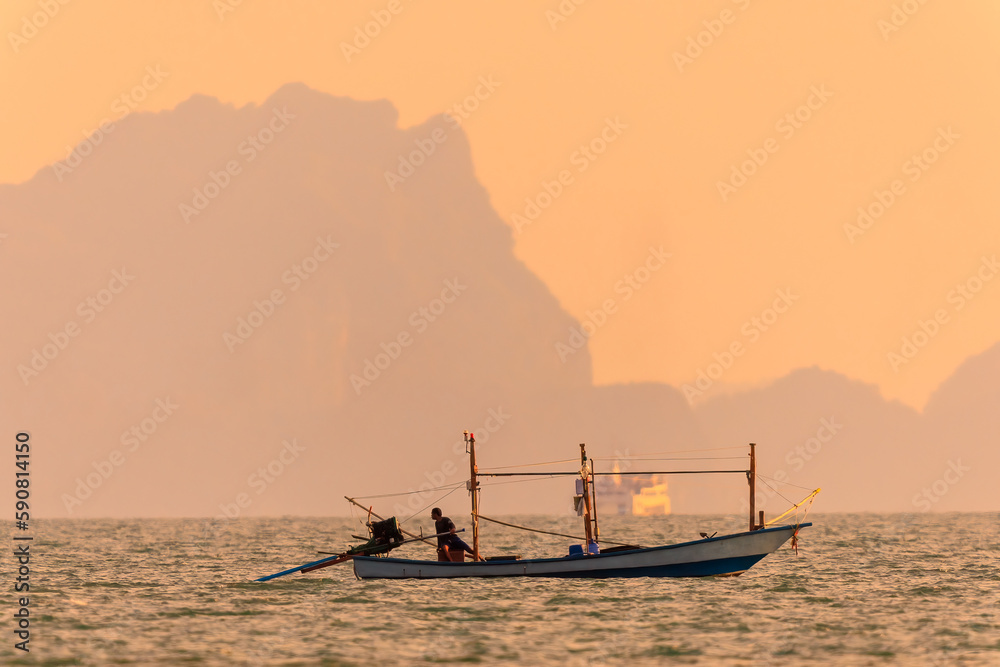 Fishing boat on sunset