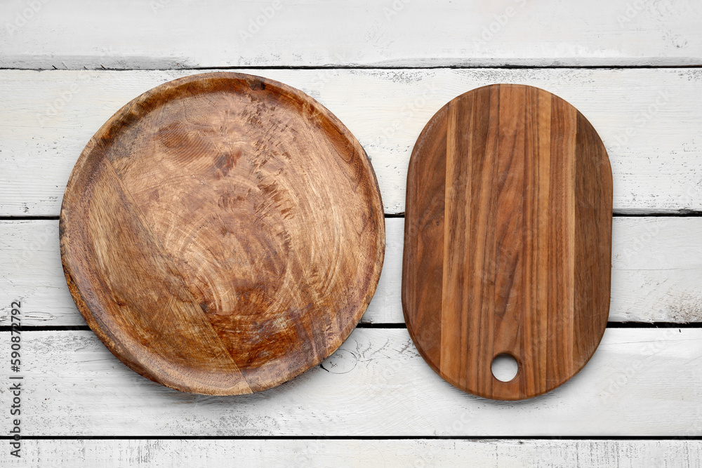 Kitchen boards on light wooden background