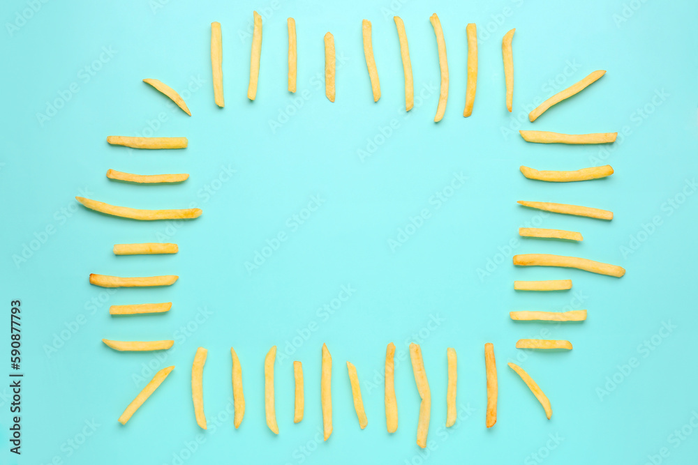 Frame made of tasty french fries on light blue background