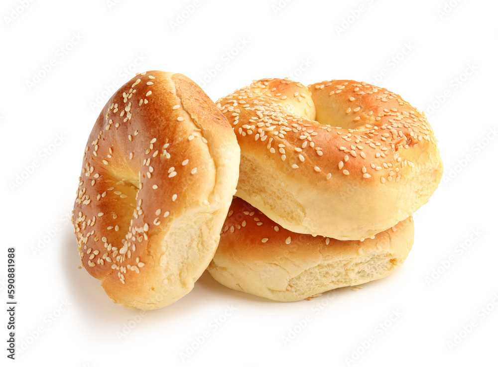 Tasty bagels with sesame seeds on white background