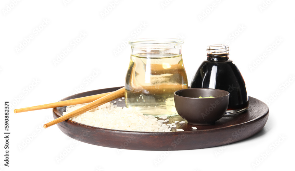 Plate with rice, vinegar, soy sauce and wasabi on white background