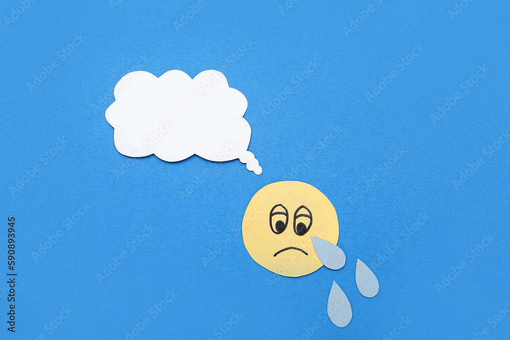 Crying smile with speech bubble on blue background. Dialogue concept